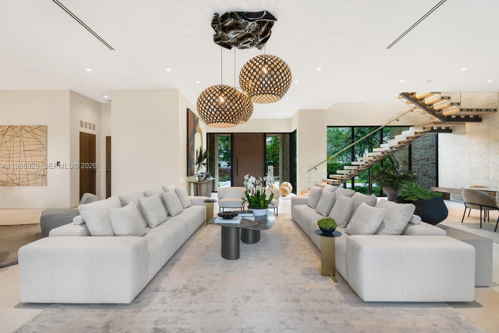 5545 Southwest 81st Terrace Miami, FL 33143 - Photo 10 of 100 a living room with furniture chandelier and large windows
