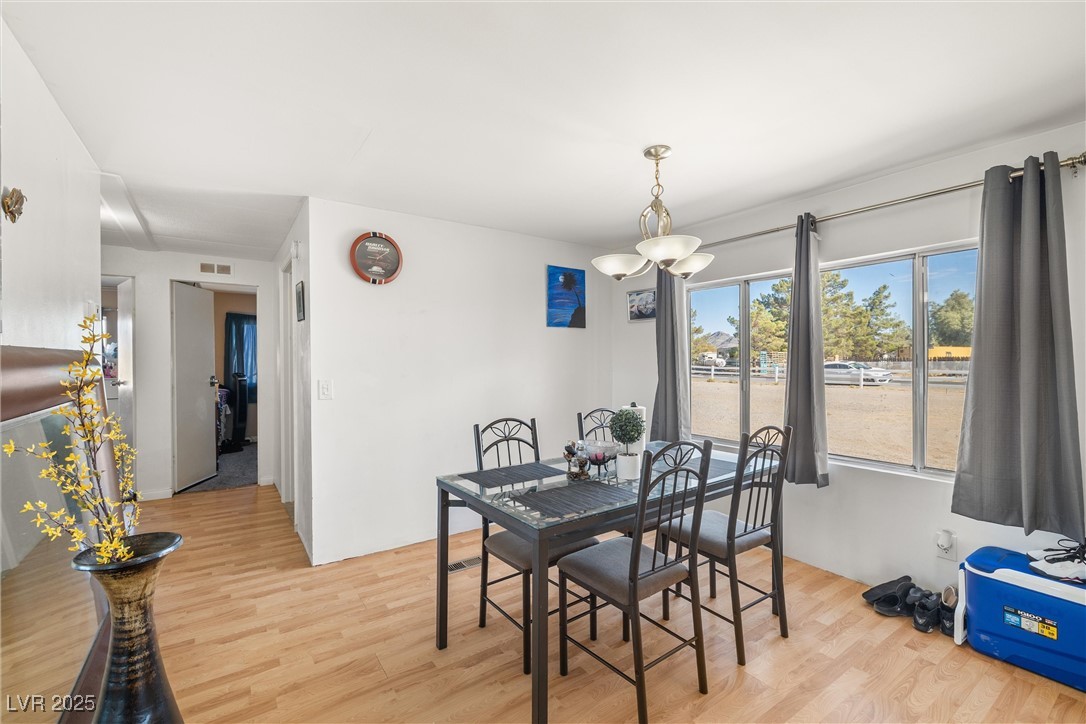 3581 West Dyer Road Pahrump, NV 89048 - Photo 14 of 31 Dining area with light wood finished floors
