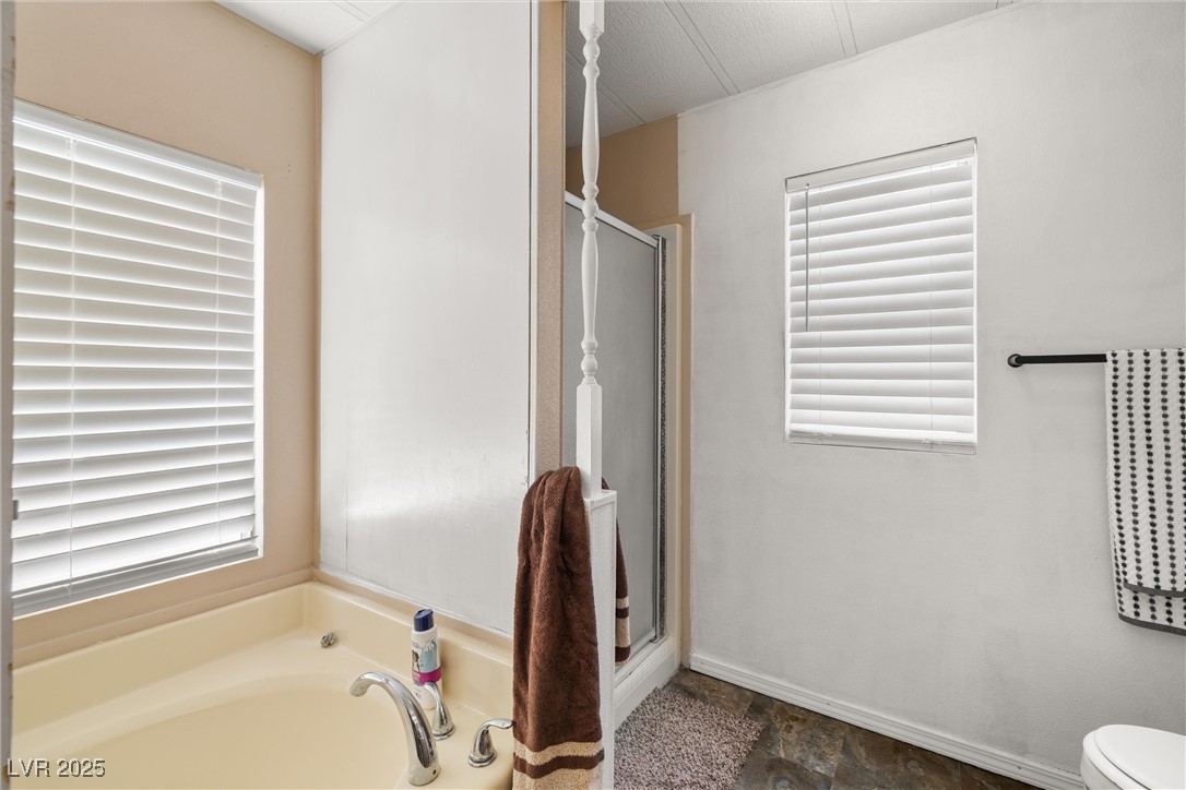 3581 West Dyer Road Pahrump, NV 89048 - Photo 18 of 31 Bathroom featuring a shower stall and a bath