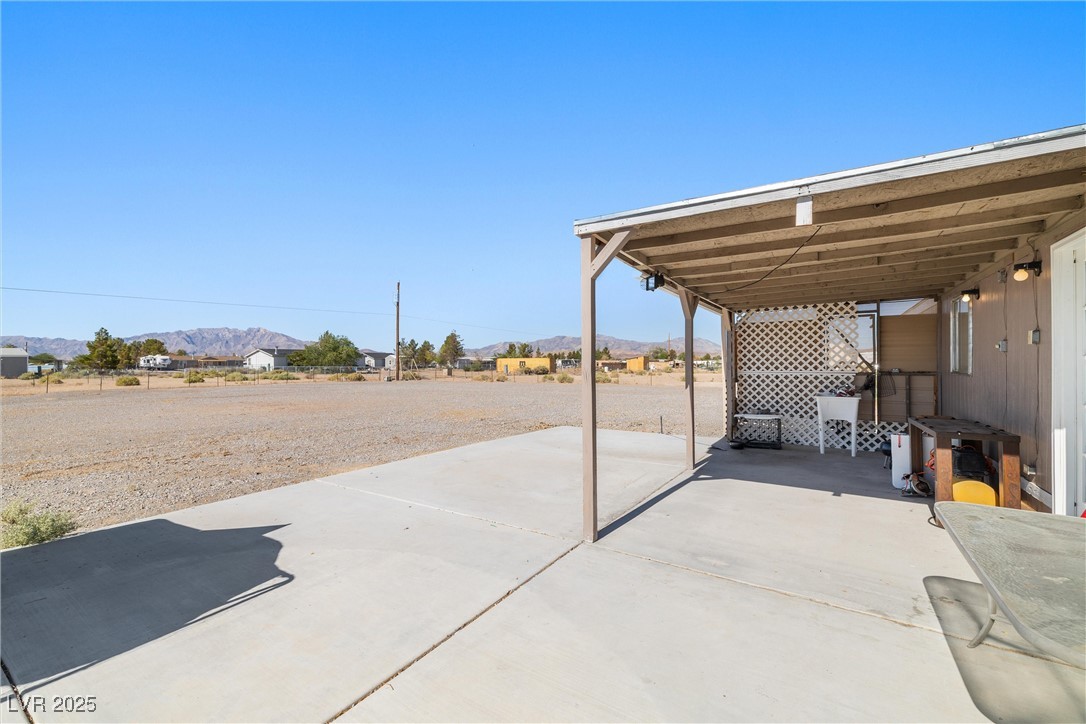 3581 West Dyer Road Pahrump, NV 89048 - Photo 23 of 31 View of patio with a mountain view