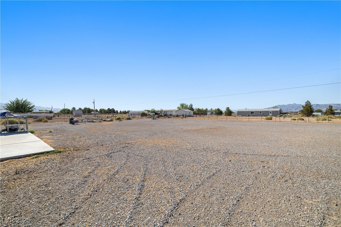 3581 West Dyer Road Pahrump, NV 89048 - Photo 25 of 31 View of yard featuring a view of rural / pastoral area