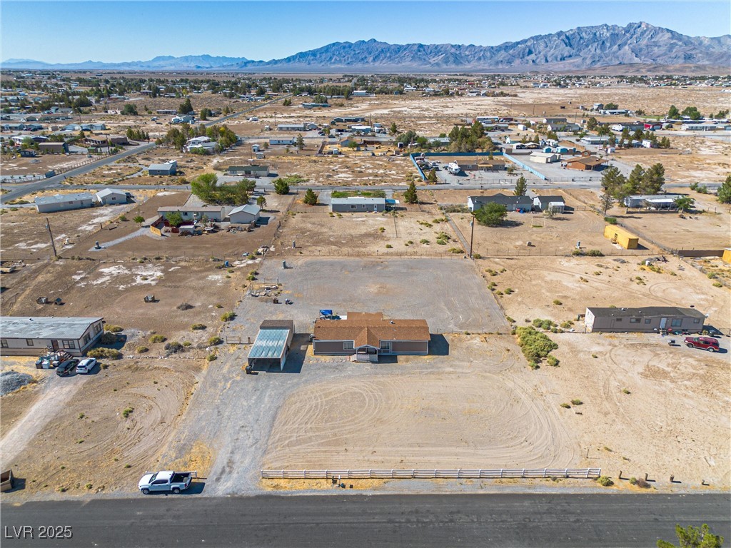 3581 West Dyer Road Pahrump, NV 89048 - Photo 30 of 31 Overview of rural landscape featuring a mountainous background and nearby suburban area