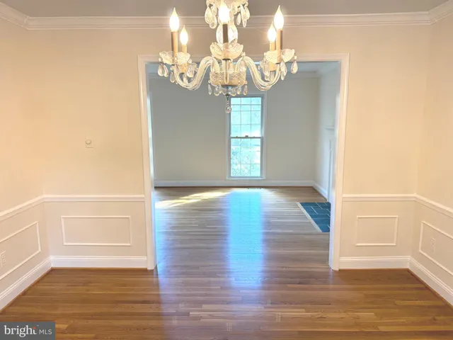 a bathroom with a double vanity sink mirror and bathtub