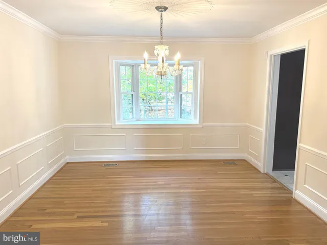 a large bathroom with a double vanity sink a mirror and a shower