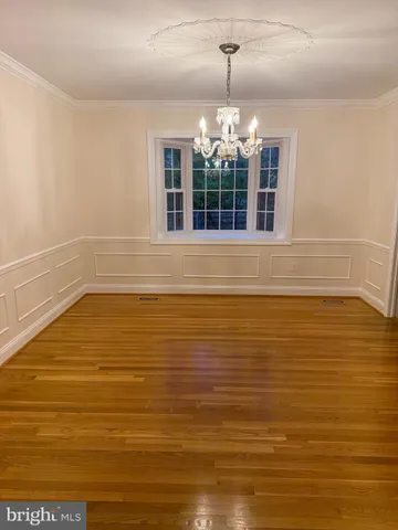 a large kitchen with stainless steel appliances kitchen island granite countertop a large counter top and stove