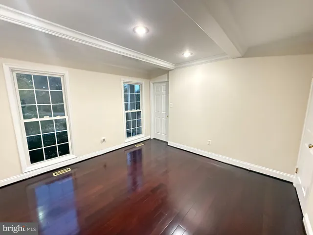 a backyard of a house with large trees