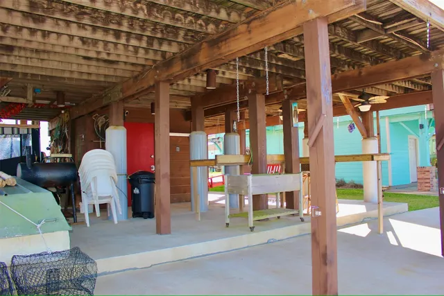 a kitchen with stainless steel appliances granite countertop a sink a stove and white cabinets