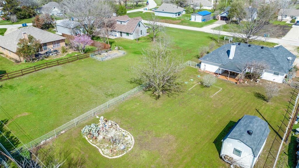 629 Concho Drive Oak Point, TX 75068 - Photo 33 of 35 an aerial view of a house with a yard swimming pool and outdoor seating