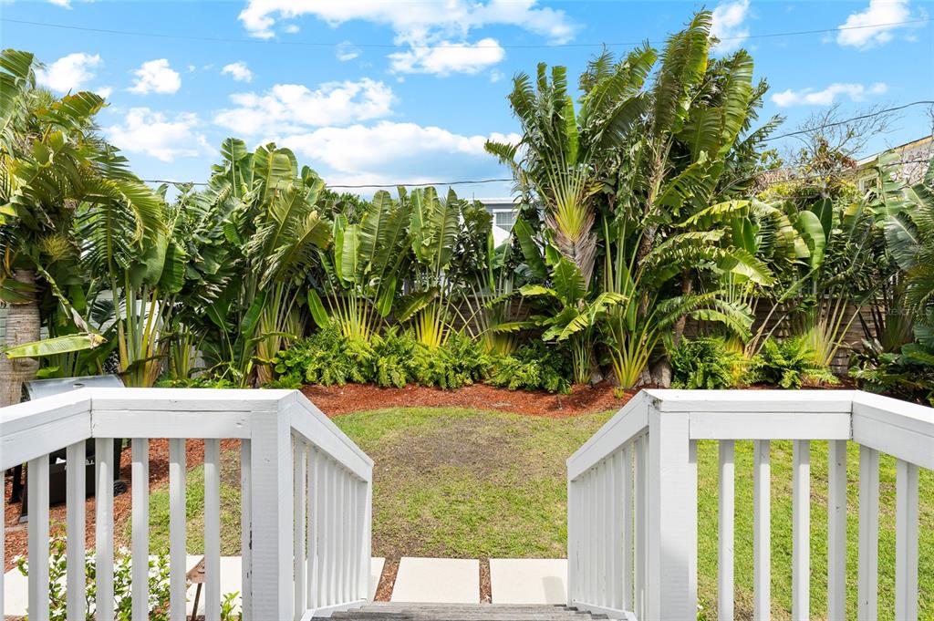 340 Palm Avenue Boca Grande, FL 33921 - Photo 27 of 38 a view of a brick house with a small yard