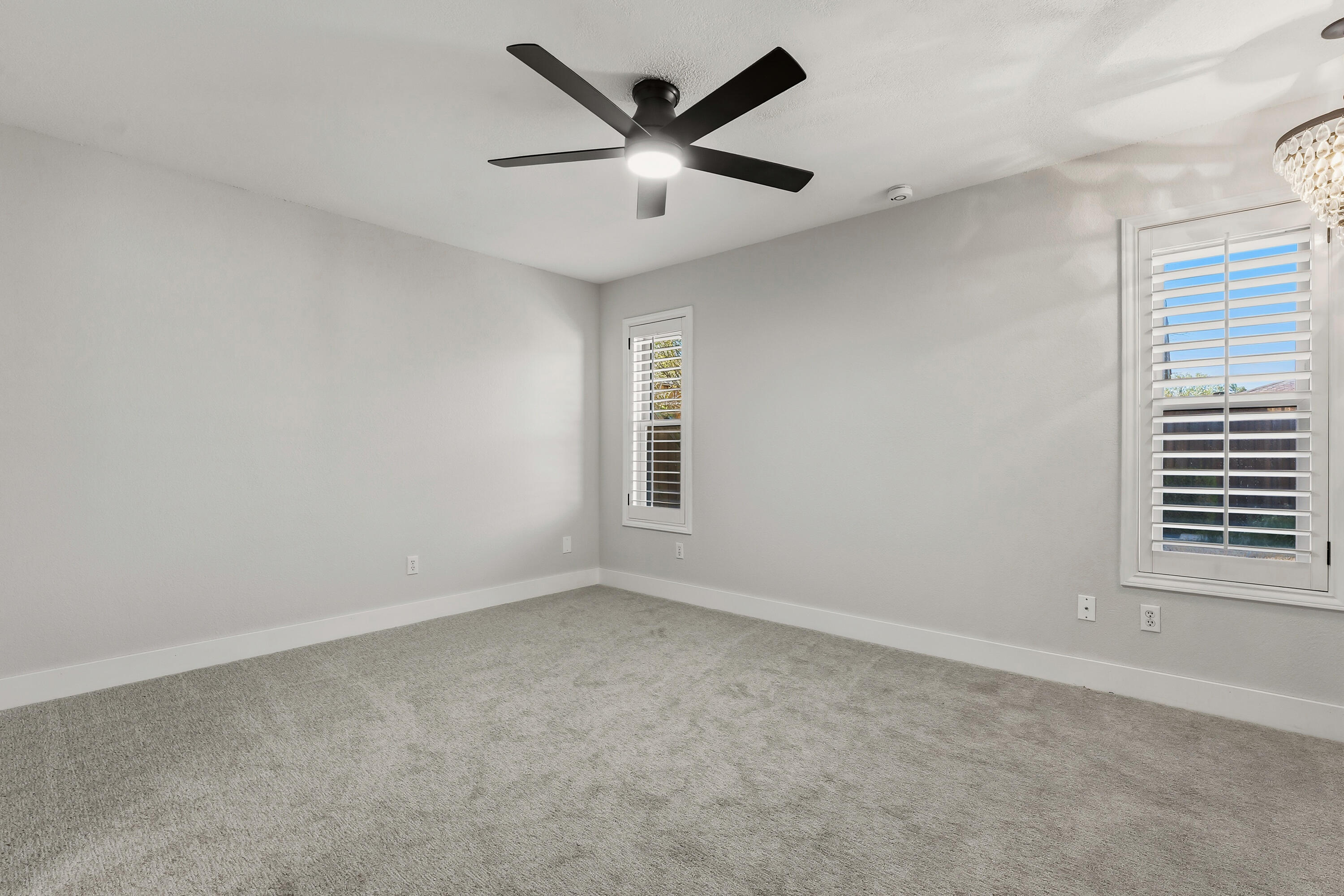 5002 94th Street Lubbock, TX 79424 - Photo 15 of 30 an empty room with a window and a ceiling fan