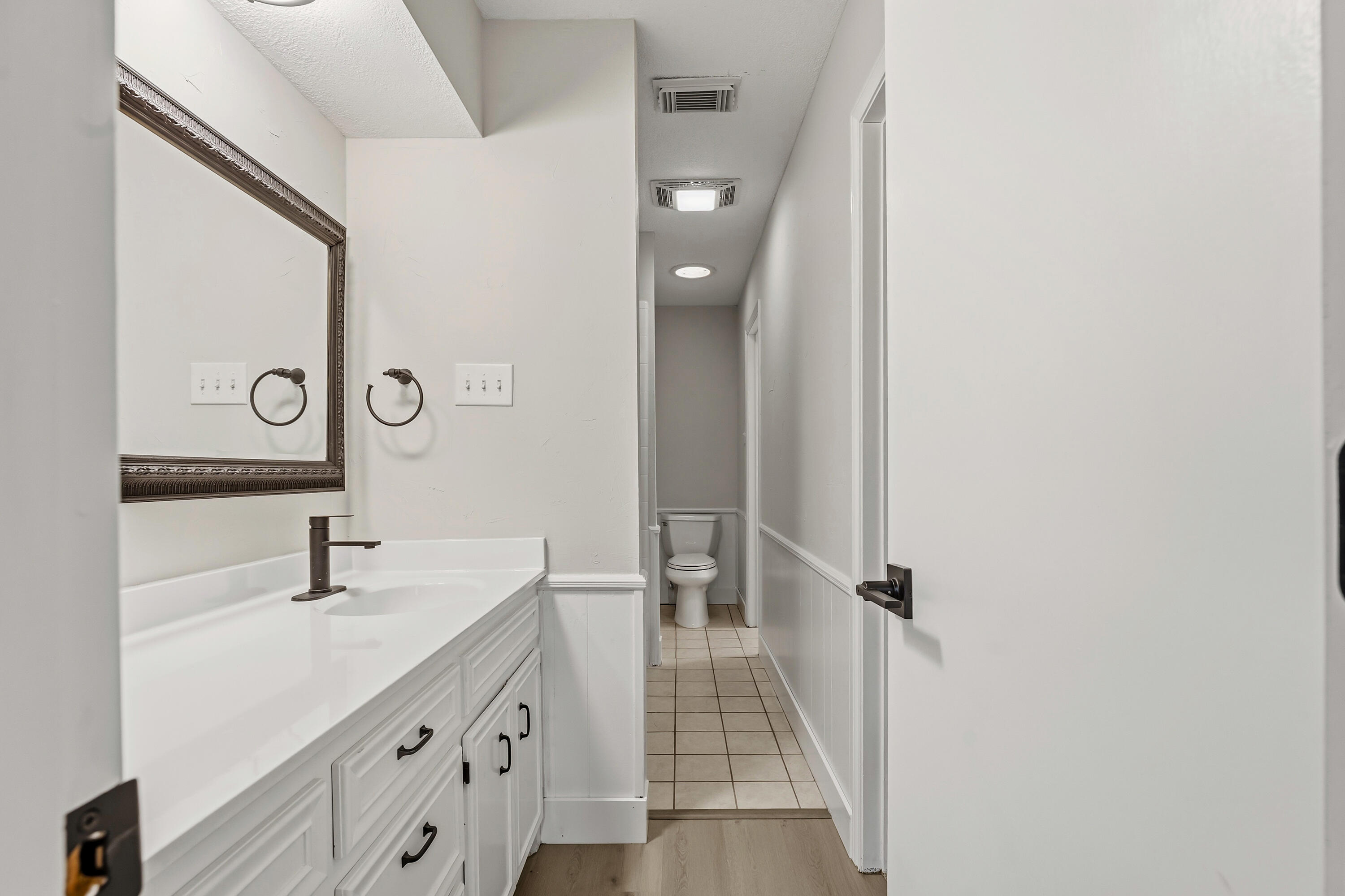 5002 94th Street Lubbock, TX 79424 - Photo 20 of 30 a bathroom with a sink and mirror