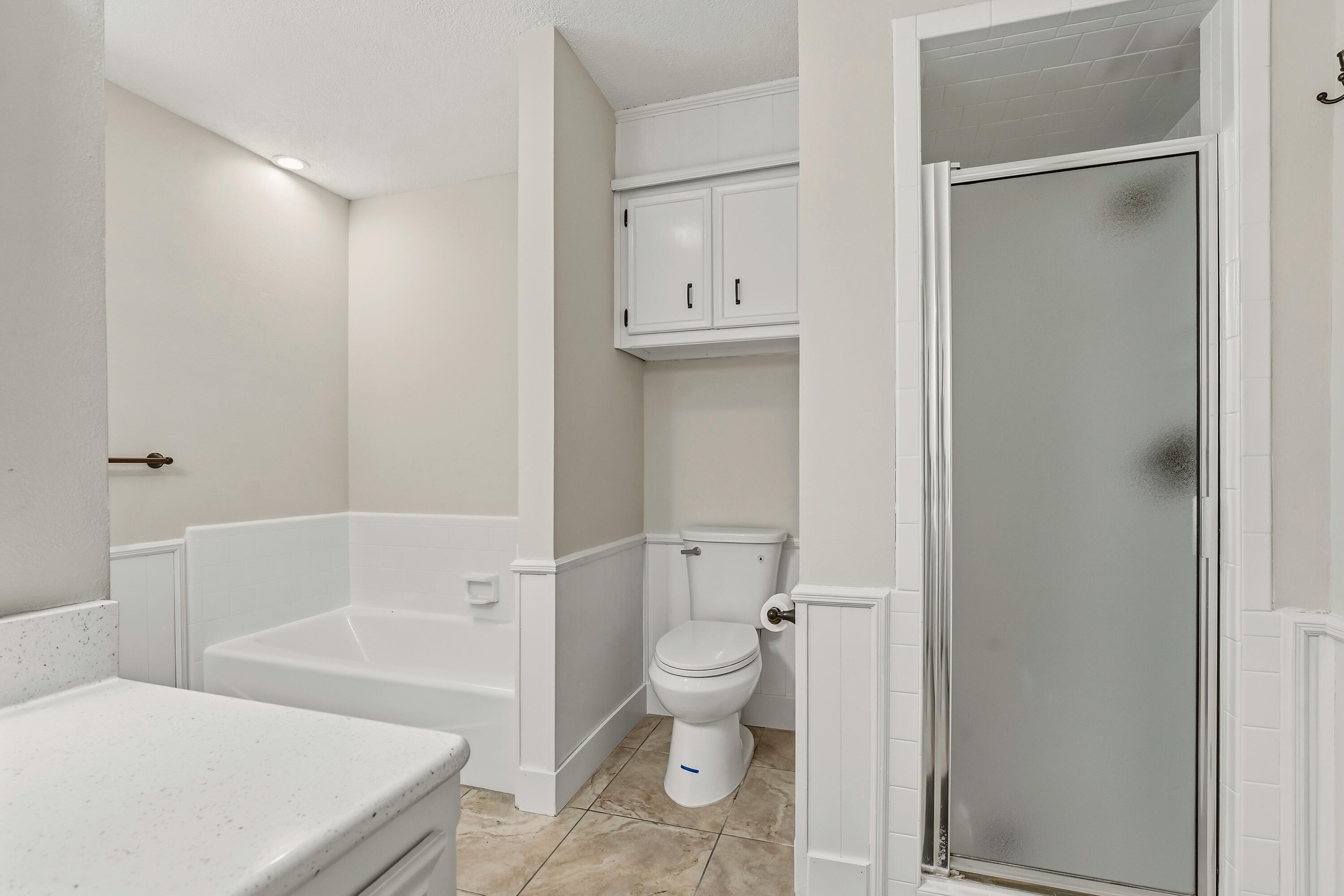 5002 94th Street Lubbock, TX 79424 - Photo 24 of 30 a bathroom with a toilet and a shower