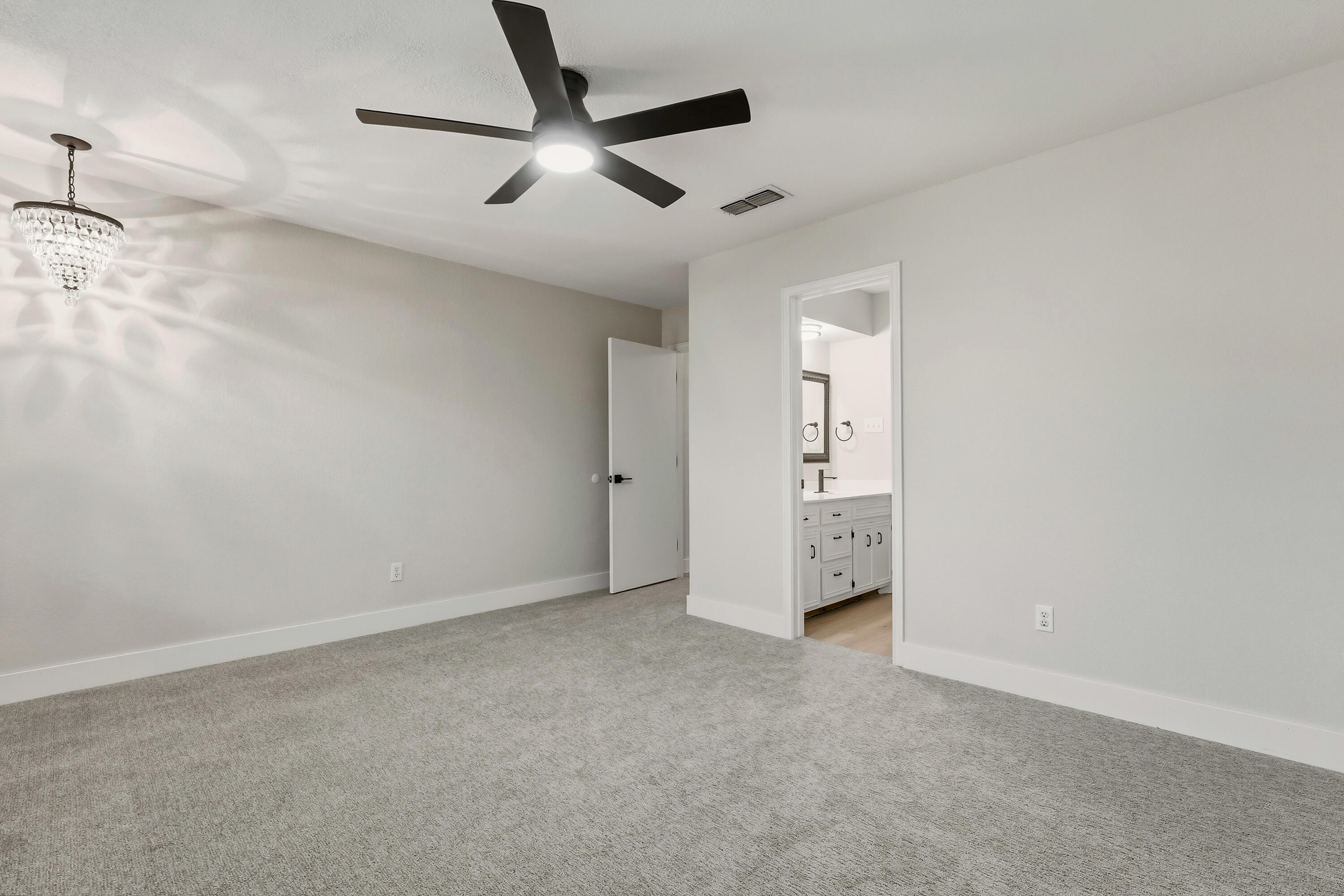 5002 94th Street Lubbock, TX 79424 - Photo 26 of 30 an empty room with a ceiling fan and window