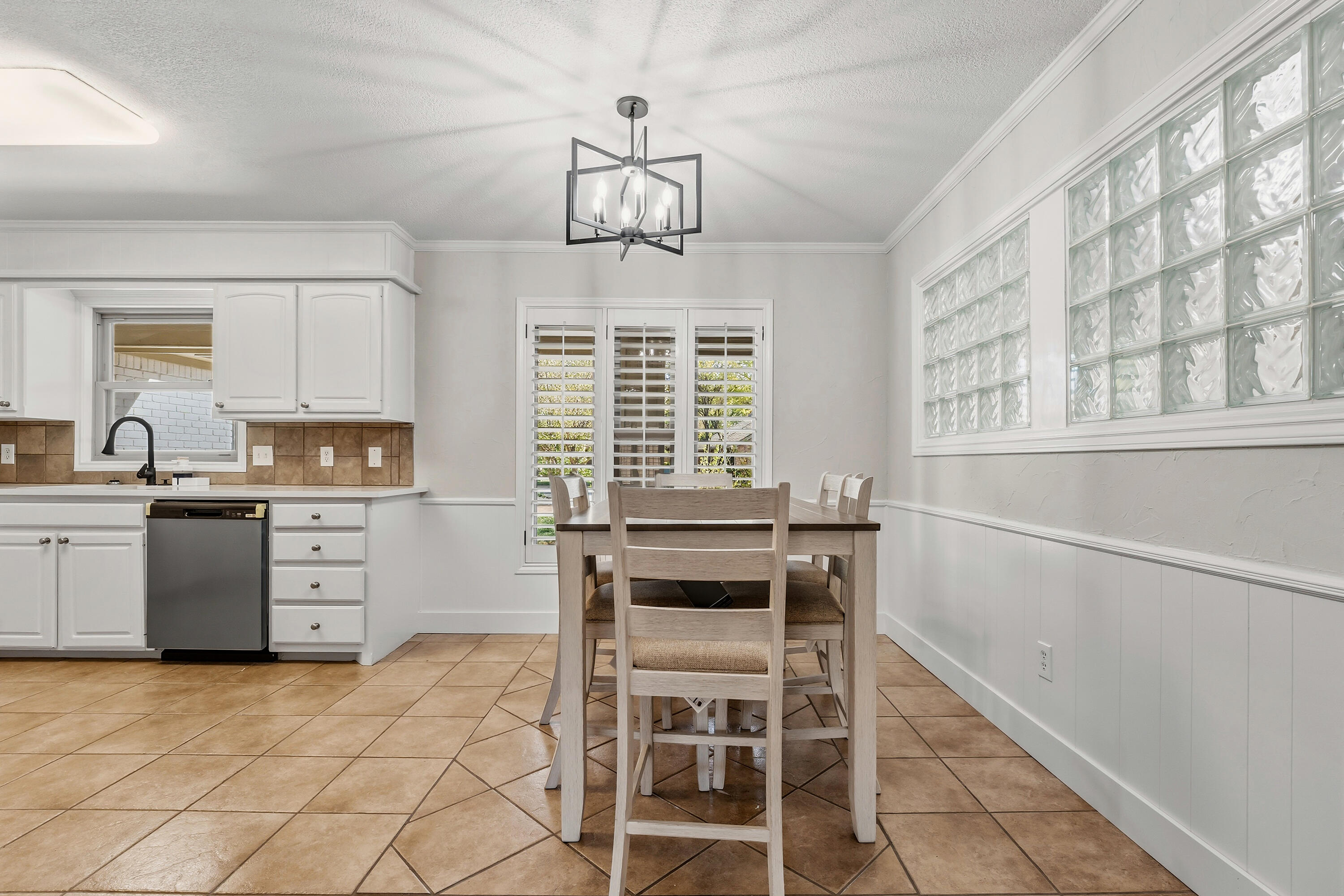 5002 94th Street Lubbock, TX 79424 - Photo 9 of 30 a kitchen with a stove a sink and cabinets