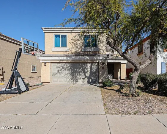 a front view of house with garage