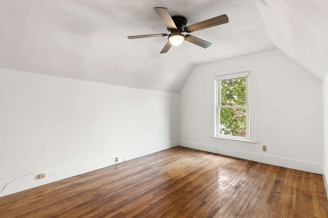 20 Fairmount Street, Unit 2 Everett, MA 02149 - Photo 12 of 12 an empty room with wooden floor fan and windows
