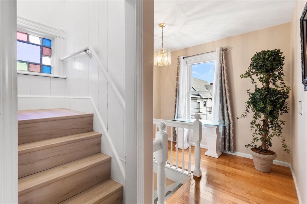 20 Fairmount Street, Unit 2 Everett, MA 02149 - Photo 8 of 12 a view of entryway and hall with wooden floor