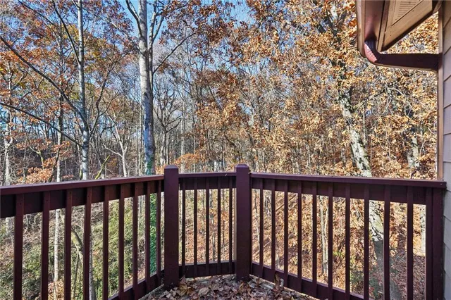 a view of a balcony with wooden fence
