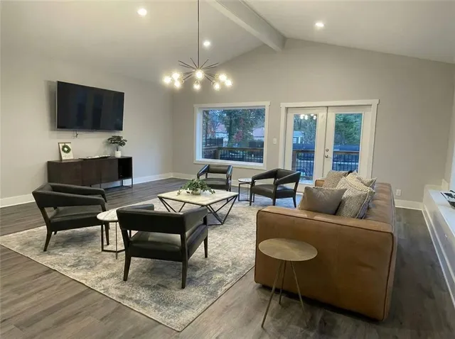 a kitchen with kitchen island granite countertop stainless steel appliances cabinets a sink and a island