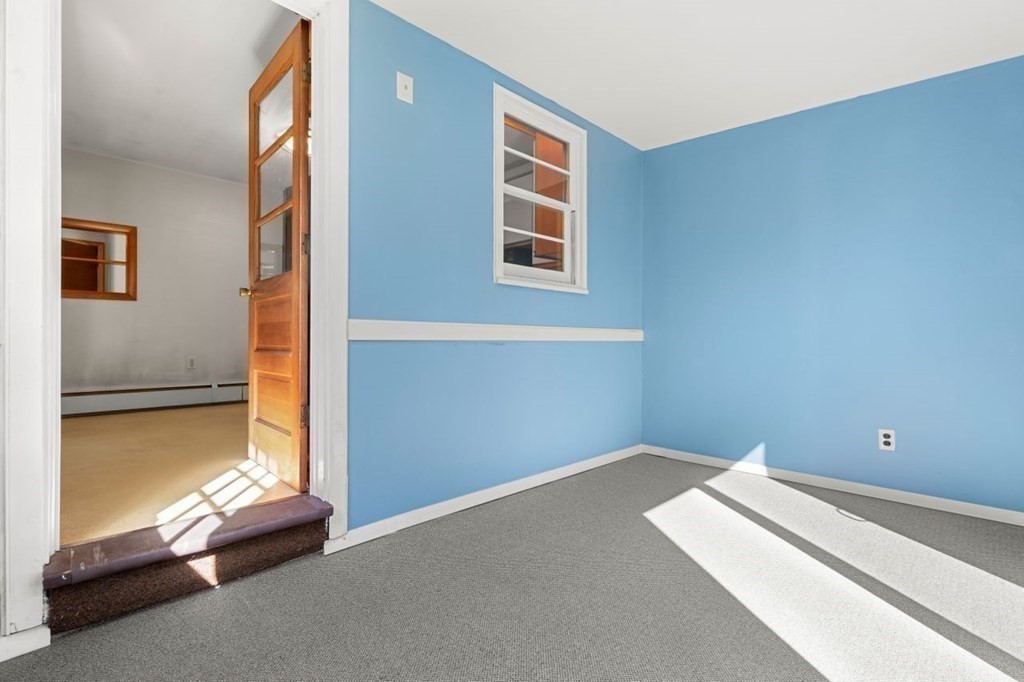 9 Butler Street Worcester, MA 01607 - Photo 11 of 39 a bed room with a bed and a window