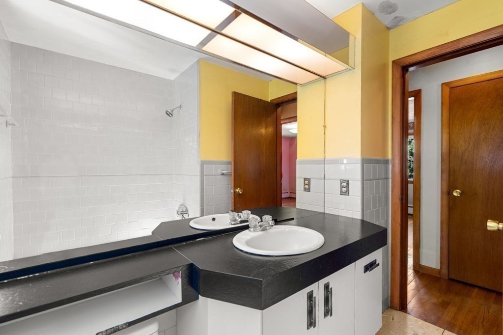 9 Butler Street Worcester, MA 01607 - Photo 22 of 39 a bathroom with a sink and a mirror