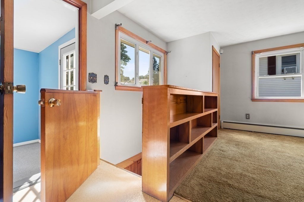9 Butler Street Worcester, MA 01607 - Photo 23 of 39 a view of room with window and wooden floor