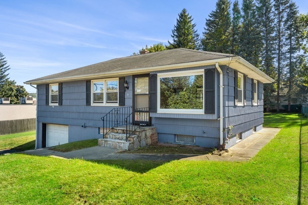 9 Butler Street Worcester, MA 01607 - Photo 3 of 39 a front view of house with yard and outdoor seating