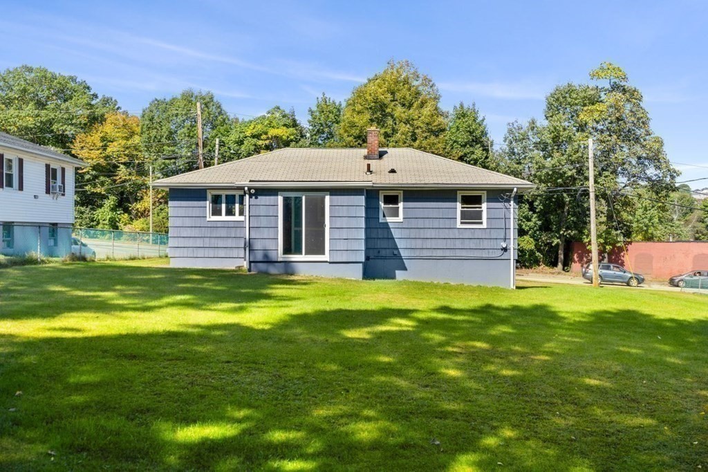 9 Butler Street Worcester, MA 01607 - Photo 32 of 39 a front view of a house with a garden