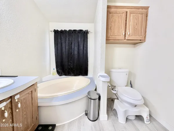 a en suite bathroom with a sink and mirror