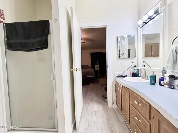 a bathroom with double vanity sinks and a mirror