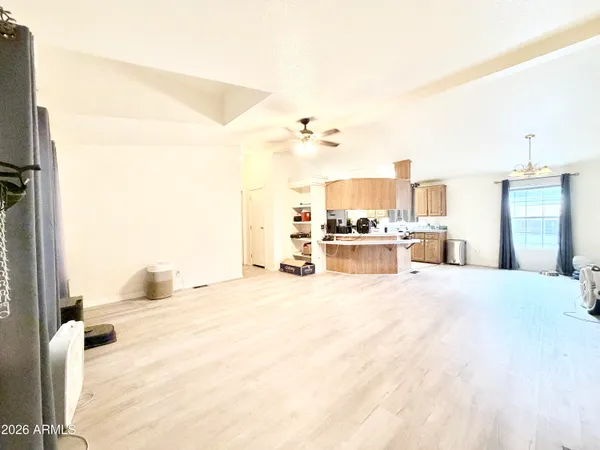 a view of a livingroom with furniture and a ceiling fan