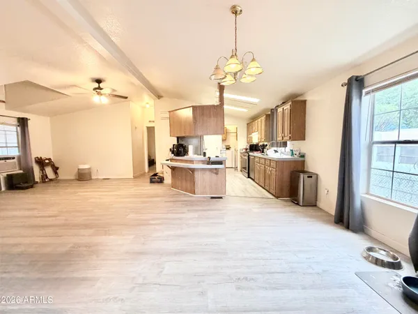 a kitchen with a sink stove and refrigerator