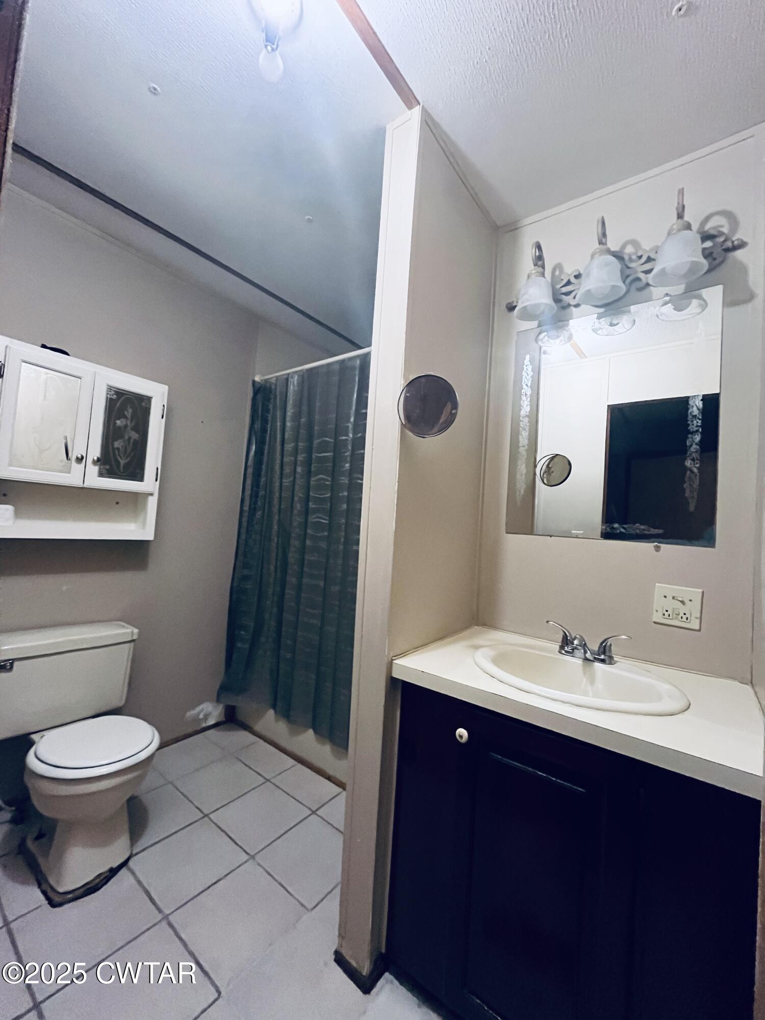 294 Ridgeway Road Sugar Tree, TN 38380 - Photo 19 of 34 a bathroom with a sink a toilet and shower
