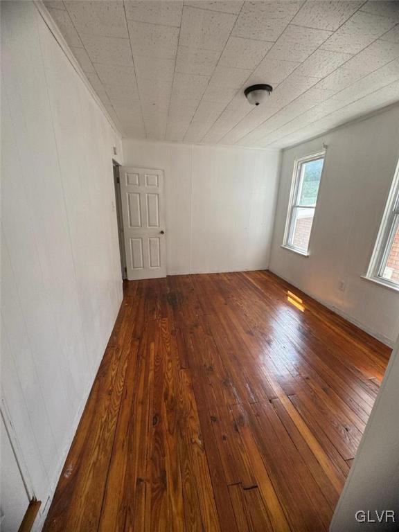 134 West Ridge Street Coaldale, PA 18218 - Photo 15 of 31 an empty room with wooden floor and windows