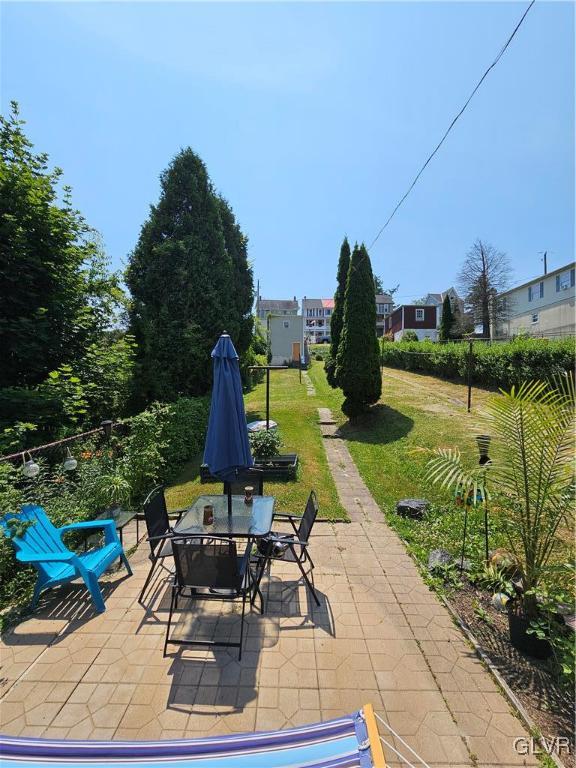 134 West Ridge Street Coaldale, PA 18218 - Photo 28 of 31 a view of a patio with a table and chairs potted plants