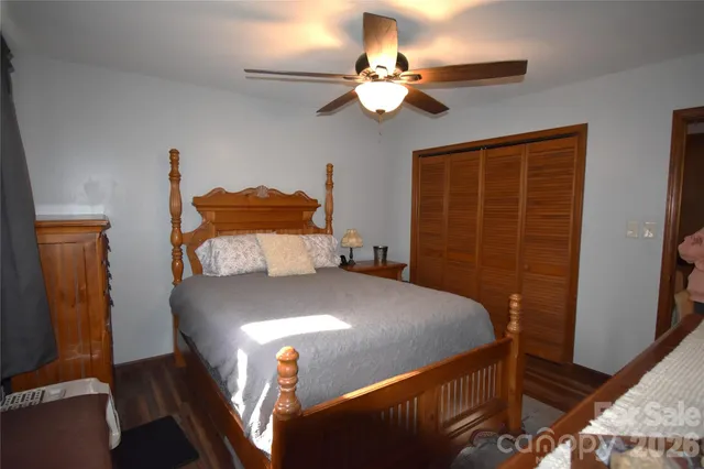 a bed sitting in a bedroom next to a window