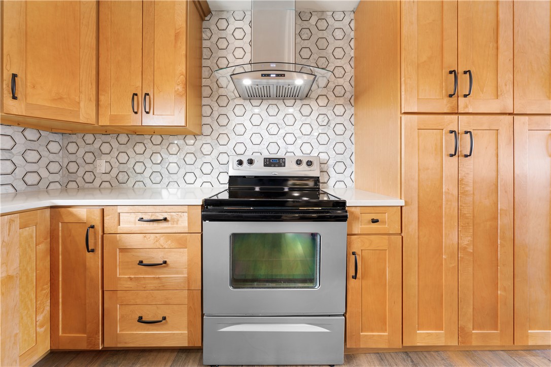 3067 Anderson Highway Liberty, SC 29657 - Photo 12 of 32 This modern kitchen features warm wood cabinetry and sleek stainless steel appliances.