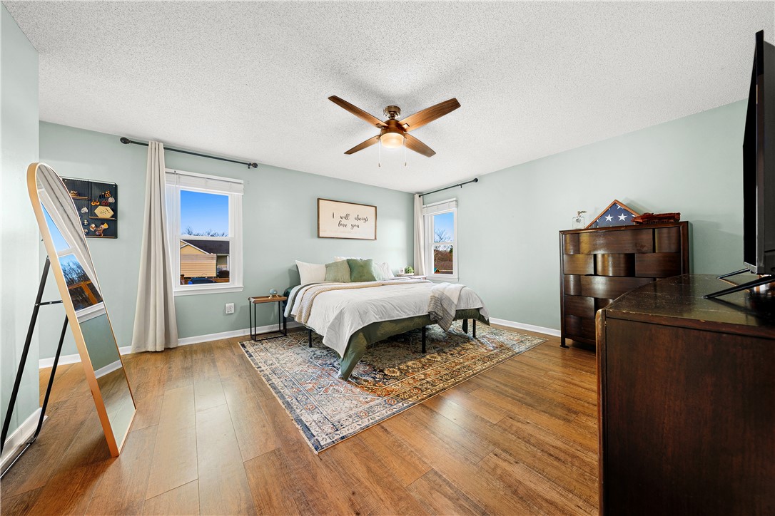 3067 Anderson Highway Liberty, SC 29657 - Photo 18 of 32 This spacious bedroom offers abundant natural light and rich hardwood flooring.