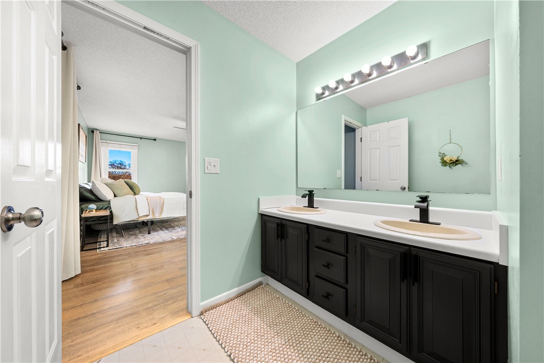 3067 Anderson Highway Liberty, SC 29657 - Photo 21 of 32 This bright bathroom features a spacious vanity and ample lighting, creating a refreshing atmosphere.