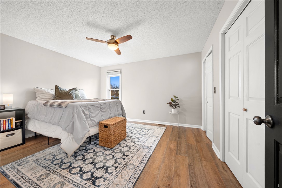 3067 Anderson Highway Liberty, SC 29657 - Photo 25 of 32 This primary bedroom offers warm wood flooring and a refreshing ceiling fan for ultimate comfort.