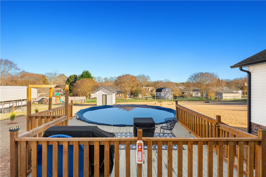 3067 Anderson Highway Liberty, SC 29657 - Photo 29 of 32 This spacious backyard features a welcoming deck, perfect for outdoor entertaining and relaxation.