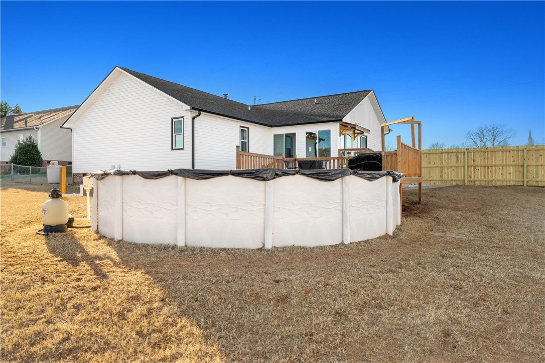 3067 Anderson Highway Liberty, SC 29657 - Photo 30 of 32 This residence features an expansive backyard with a pool and an elevated deck for outdoor enjoyment.