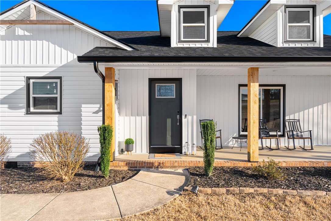 3067 Anderson Highway Liberty, SC 29657 - Photo 5 of 32 This inviting home features a covered porch, dormer windows, and a well-maintained front yard.