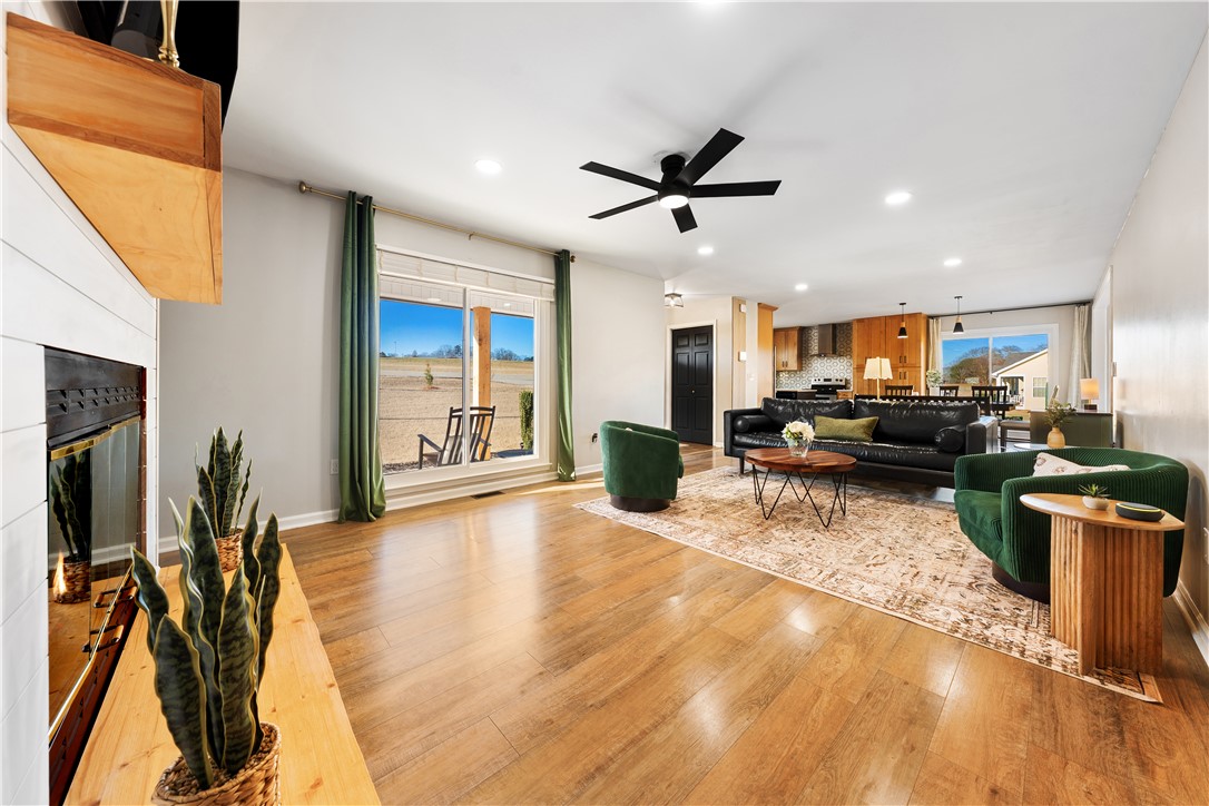 3067 Anderson Highway Liberty, SC 29657 - Photo 9 of 32 This inviting living space features gleaming hardwood floors and abundant natural light.