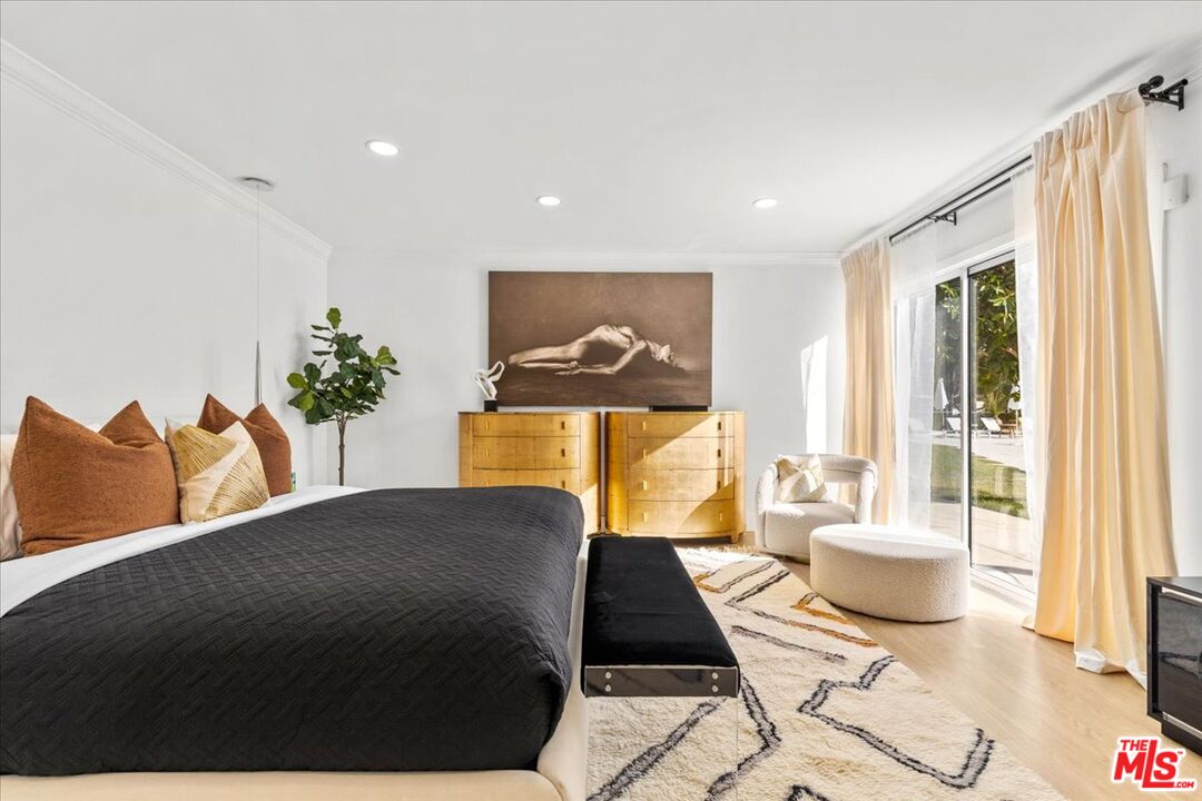 1650 Clear View Drive Beverly Hills, CA 90210 - Photo 11 of 31 a living room with furniture and a potted plant