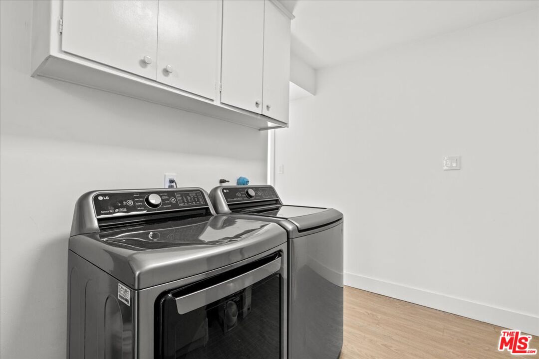 1650 Clear View Drive Beverly Hills, CA 90210 - Photo 21 of 31 a view of storage and utility room with washer and dryer