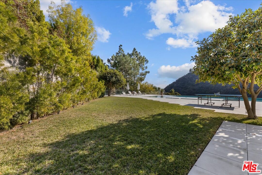 1650 Clear View Drive Beverly Hills, CA 90210 - Photo 24 of 31 a view of a swimming pool with an outdoor space