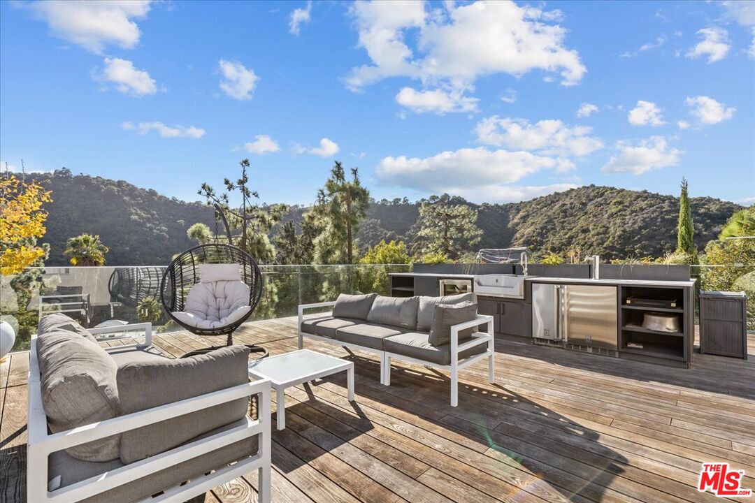 1650 Clear View Drive Beverly Hills, CA 90210 - Photo 25 of 31 a view of a terrace with furniture