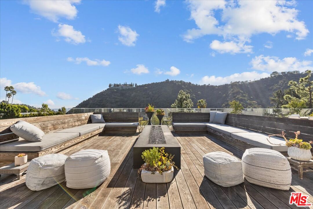 1650 Clear View Drive Beverly Hills, CA 90210 - Photo 27 of 31 a view of a terrace with couches