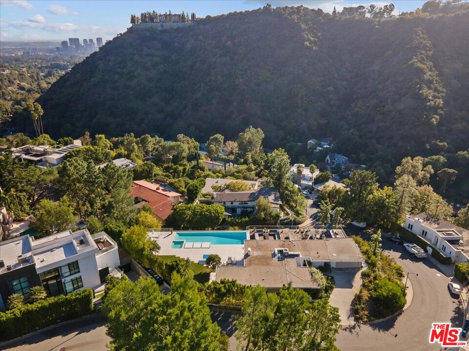 1650 Clear View Drive Beverly Hills, CA 90210 - Photo 29 of 31 a view of a lake with a building in the background